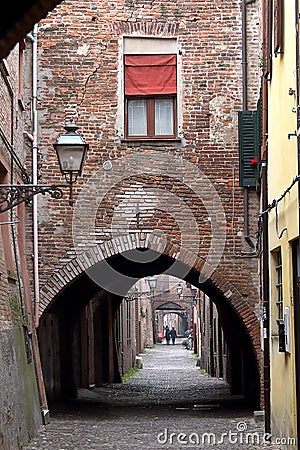 Ferrara, Italy: the picturesque arched alley Via delle Volte Editorial Stock Photo