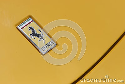 Ferrari logo on yellow sport car Editorial Stock Photo