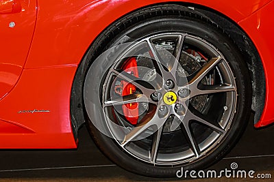 Ferrari sports car tyre close-up at Ferrari World amusement park at Yas Island - Abu Dhabi, United Arab Emirates Editorial Stock Photo