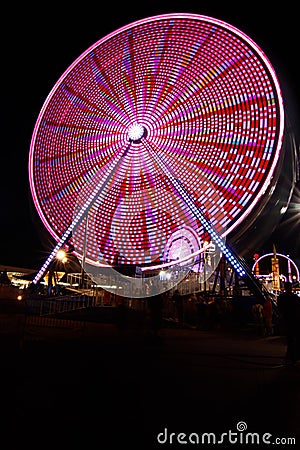 Ferris Wheel and Carnival Fair at Night Stock Photo