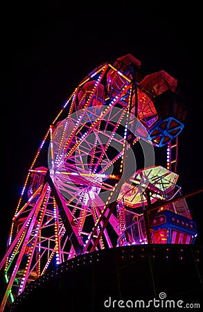 Ferris wheel at night with red light Stock Photo