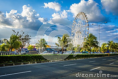 Ferris wheel and Seaside Boulevard, in Pasay, Metro Manila, The Editorial Stock Photo