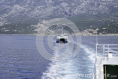 Ferry on the blue sea, mountain in the background, Croatia, Europe, Adriatic Stock Photo