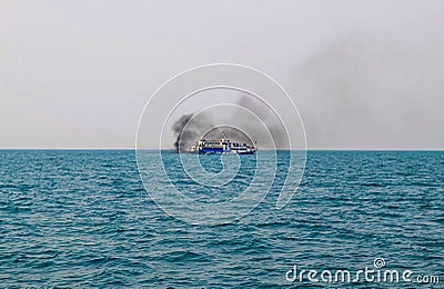 Ferry boat of Bay of Bengal smoke coming from its chimney. Black exhaust fumes coming from the chimney of a moored tanker. Editorial Stock Photo