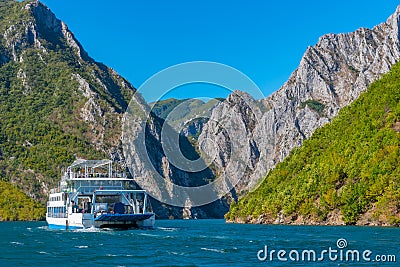 Ferry cruising lake Koman in Albania Stock Photo