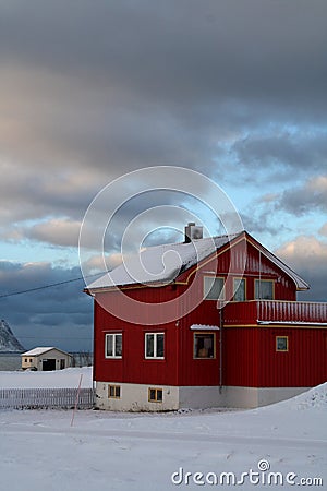 A ferry point of view of Houses covered with snow in Lofoten islands-Norway. Stock Photo