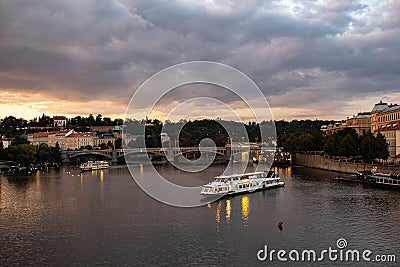 The ferry sails on the Vltava river in the evening Editorial Stock Photo