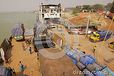 Ferry staff and passengers present at unloading Daulatdia ferry boats at Ganga river bank in Chhota Dhulandi, Bangladesh. Editorial Stock Photo