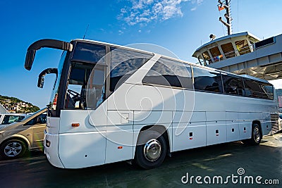 ferry transports bus and cars, passengers, across the bay, close view of autobus and deck Stock Photo
