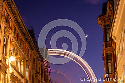Ferry Wheel in Wiesbaden city center, in the middle of old buildings Stock Photo