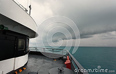 Ferryboat and Dramatic Storm Clouds. Stock Photo