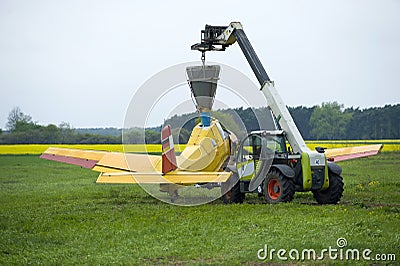 Fertilizing field by aircraft Stock Photo