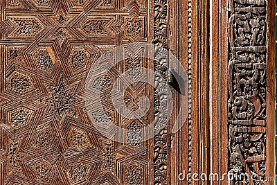 FES, MOROCCO - APRIL 01, 2023 - Traditional oriental facade at the courtyard of madrasa Bou Inaniya in the medina of Fes Editorial Stock Photo