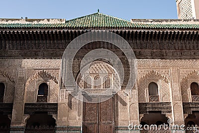 FES, MOROCCO - APRIL 01, 2023 - Traditional oriental facade at the courtyard of madrasa Bou Inaniya in the medina of Fes Editorial Stock Photo