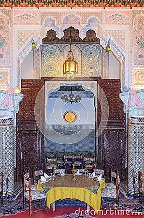 Moroccan restaurant decorated with mosaic and carvings in Fes Editorial Stock Photo
