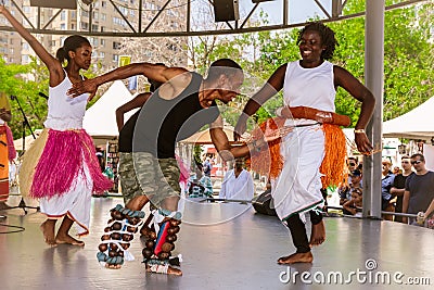 Festival of diversity dance and music, group of joyful, happy smile people enjoying their time by dancing and having fun on the st Editorial Stock Photo