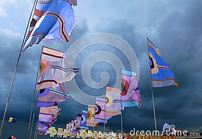 Festival flags waving against dramatic stormy sky Editorial Stock Photo