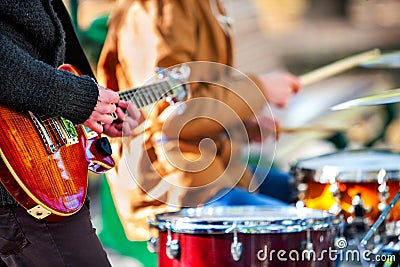 Festival music band. Friends playing on percussion instruments city park. Stock Photo