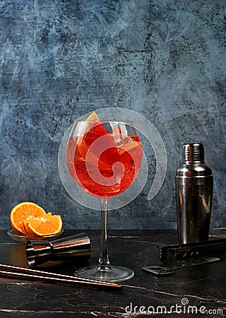 Festive alcoholic cocktail Aperol spritz in glasses on a dark background, concept for bar and New Year's Eve, alcoholic Stock Photo