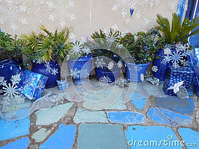 Festive Blue Pots & Blue Tiles With Christmas Gifts Wrapped in Blue Paper Stock Photo