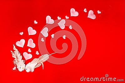 Festive background with enamored kissing birds and hearts on a red background. Valentine's day card or wedding Stock Photo