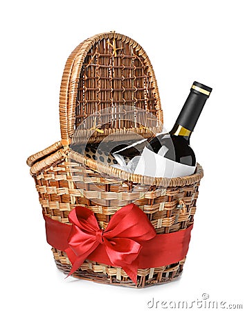 Festive basket with bottle of wine and gift Stock Photo