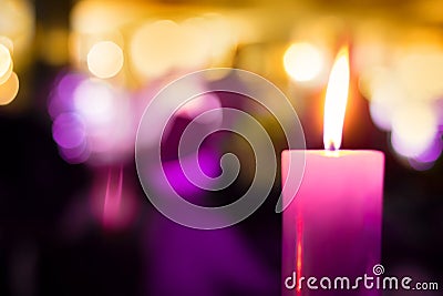 Festive Beautiful blurred Background with single burning candle Stock Photo