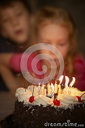 Festive candles blow out on a birthday cake Stock Photo