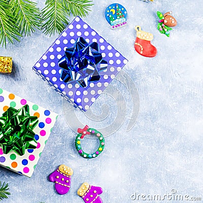 Festive Christmas background with fir branches, Christmas symbols, giftboxes, colorful decorations, copy space Stock Photo