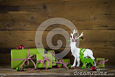 Festive christmas background with presents and reindeer in red a Stock Photo