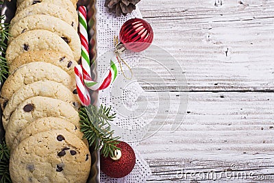 Festive Christmas card. Homemade cookies with chocolate drops for Santa Claus in the baking dish is decorated fir Stock Photo