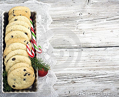 Festive Christmas card. Homemade cookies with chocolate drops for Santa Claus in the baking dish is decorated fir Stock Photo