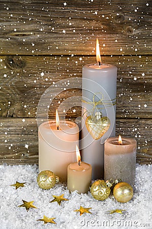 Festive christmas decoration in gold and white: four red burning Stock Photo