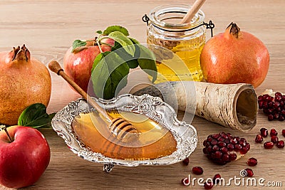 A festive composition of the Jewish New Year of Roshkasan. traditional symbols of the holiday - ripe apples, honey, pomegranate. Stock Photo