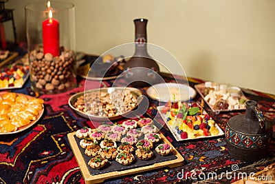 Festive dinner in the Caucasian style: tartlets with pate, nuts, berry canapes, wine Stock Photo