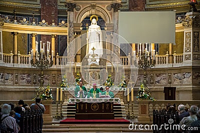 Festive Easter Church Prayer at St. Stephen`s Catholic Basilica in Budapest, Hungary Editorial Stock Photo