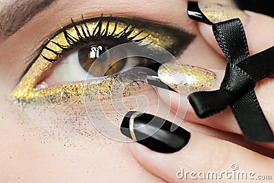 Festive fashion black gold make up and French manicure Stock Photo