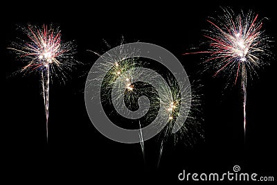 Festive fireworks colorful display isolated in bursting shapes on black background. Stock Photo