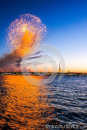 Festive fireworks on the waterfront at sunset Stock Photo