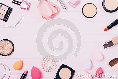 Festive flat layout of decorative feminine cosmetics Stock Photo