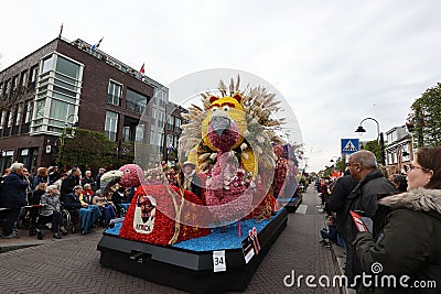 Festive float decorated with a vibrant floral arrangement at the Flower Parade Bollenstreek Editorial Stock Photo