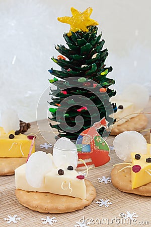 Festive food for the New Year 2020 - year of the white rat mouse. Cheese appetizer on a cracker. Chinese tradition Stock Photo