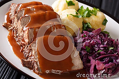 Festive German full dinner Sauerbraten - beef stew with gravy se Stock Photo