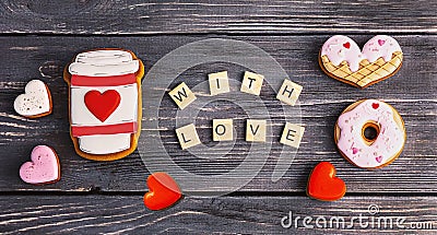 Festive gift gingerbread for Valentine's Day in the shape of a cup of coffee, hearts and a donut Stock Photo