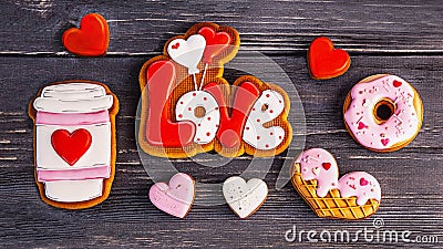 Festive gift gingerbread for Valentine's Day in the shape of a cup of coffee, hearts, a donut, the word love Stock Photo