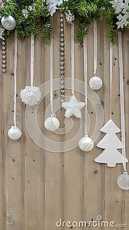 Festive Gifts Decorated with Linen Cord, Cinnamon, Pine cones, Walnuts. Toned image. Snow Drawn. Stock Photo