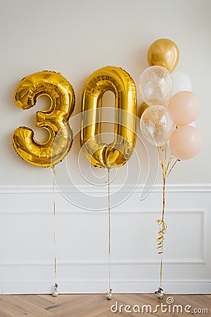 Festive helium balloons in gold and white, number 30 Stock Photo