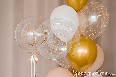 Festive helium balloons in gold and white for the 30th anniversary Stock Photo
