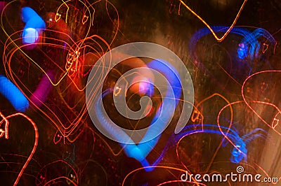 Festive long exposure lights background with hearts. St. Valentine day. Stock Photo