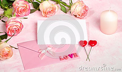 Festive mock up with roses, envelope, empty blank sheet, candle, hearts, letters LOVE. Copy space. Stock Photo